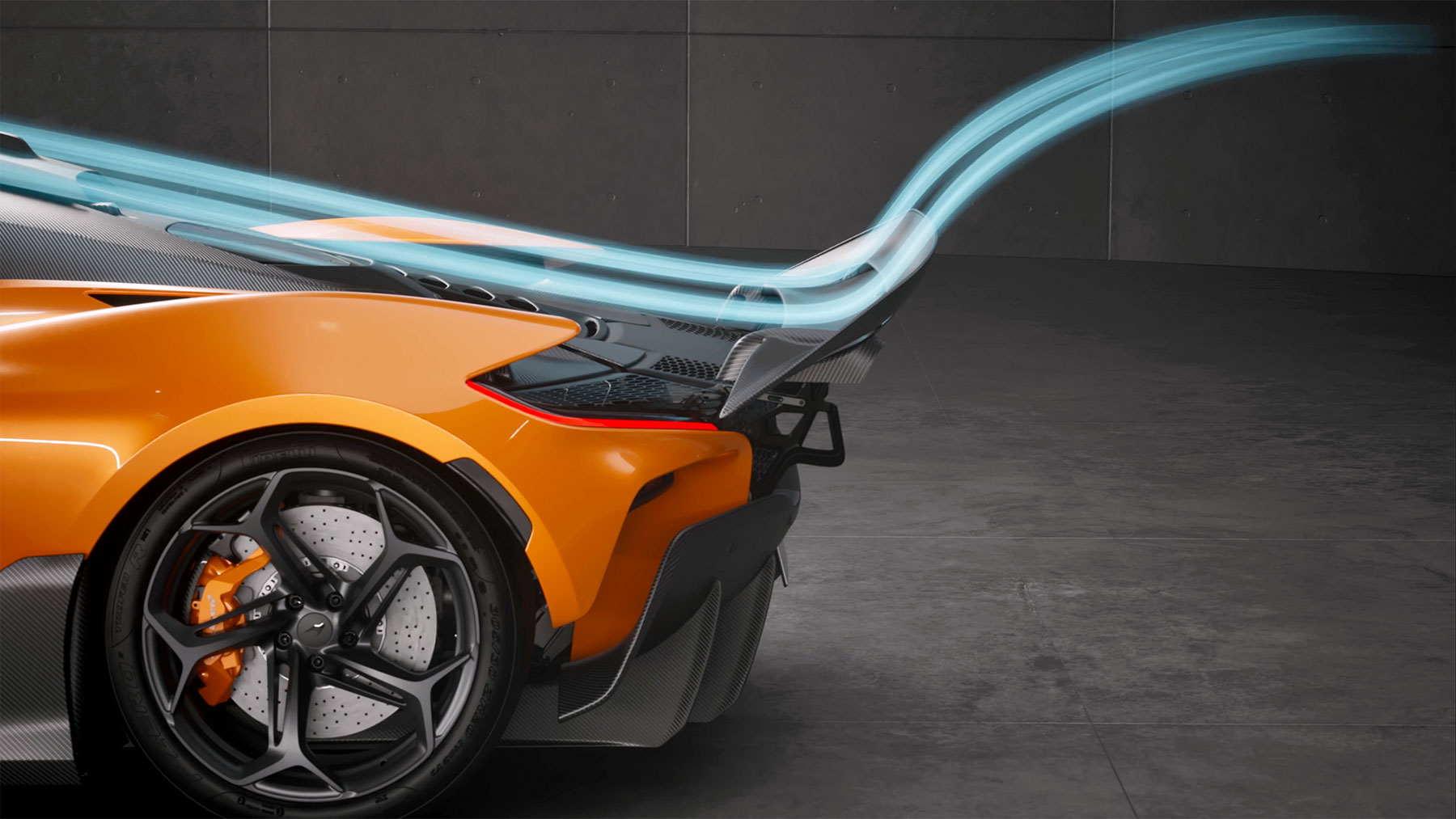  A rear three-quarter close-up of an orange McLaren supercar with an illuminated blue light trail illustrating airflow over its rear wing and sleek bodywork.