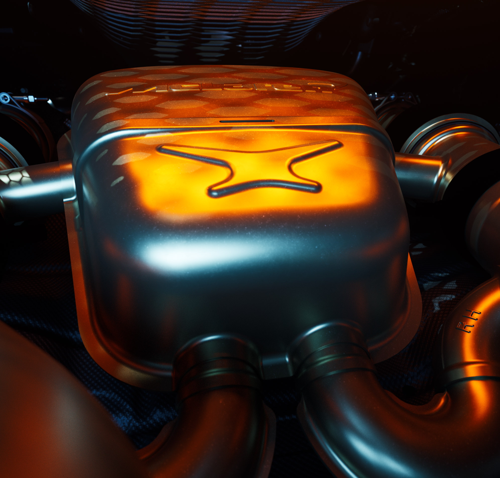 A close-up, studio shot of a McLaren 750S's V8 engine manifold, with a warm orange light glowing from beneath the metal component, highlighting the intricate design.