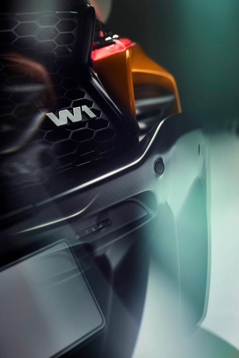 A detailed shot of the McLaren W1's rear, showing the 'W1' badge over a distinctive honeycomb grille.