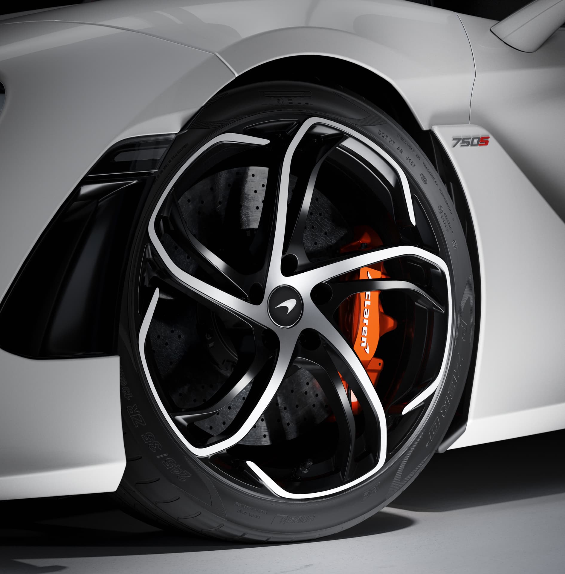 Close up of McLaren 750S Spider wheel with orange caliper.