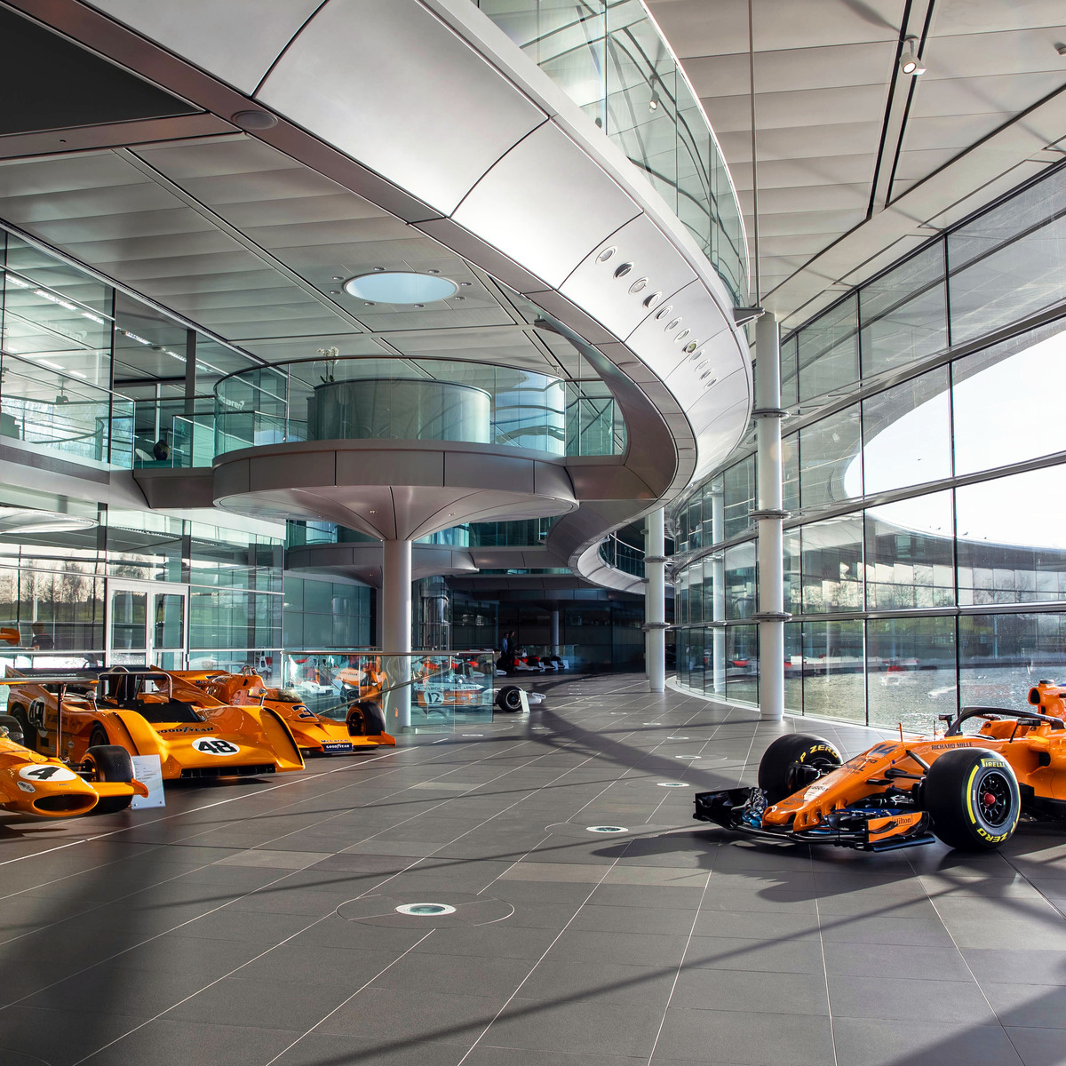 McLaren Technology Centre Boulevard lines with previous McLaren Formula 1 racing cars.