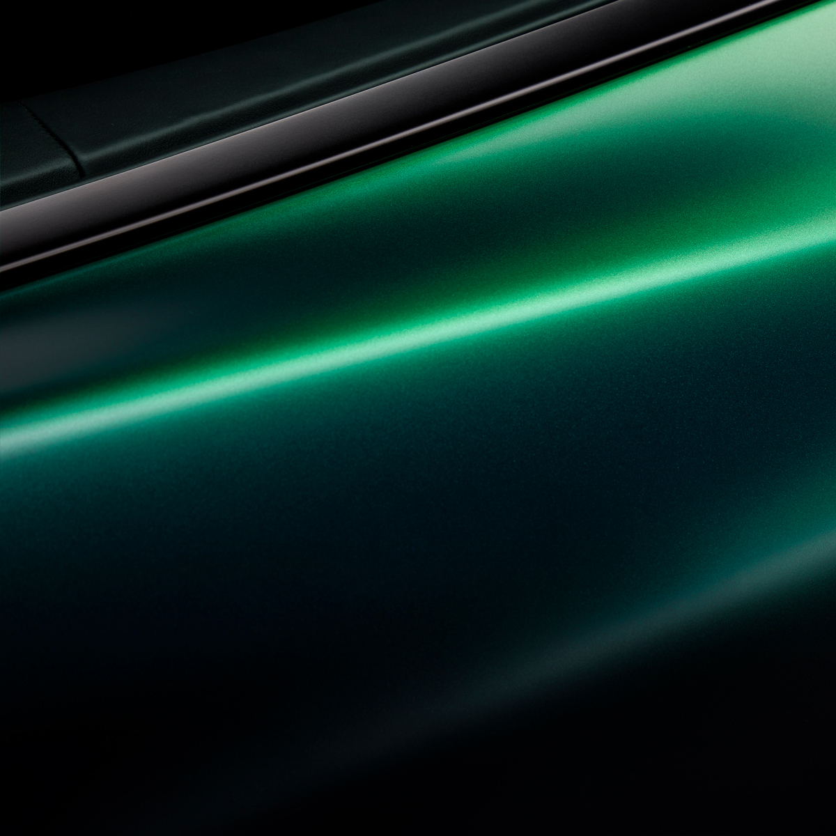 Close up of McLaren Verdant theme GT green paint.
